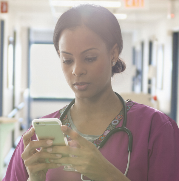 Nurse uses nursing communication on smartphone to connect with care team members