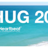 Text reads "MHUG 2018" above the Mobile Heartbeat logo, set against a background image of the beach in Sunny Isles Beach, Florida.