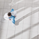 doctor running through hospital from birds eye view