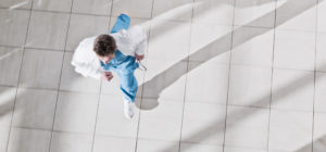 doctor running through hospital from birds eye view