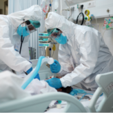 Clinicians intubating ICU patient