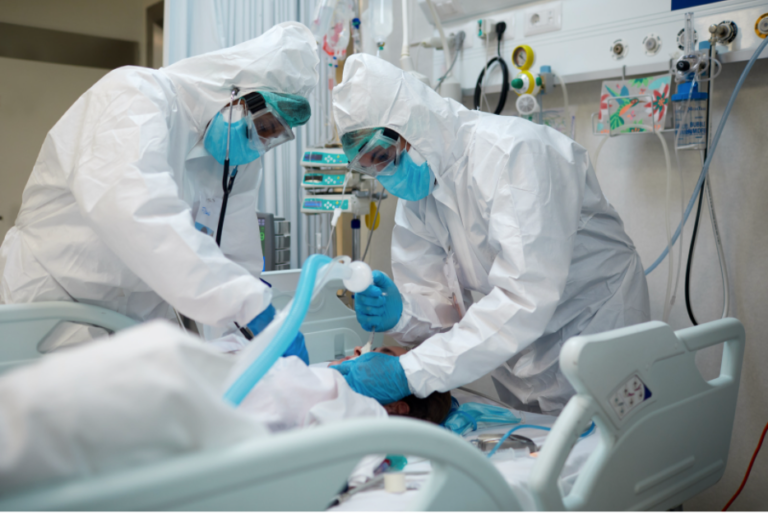 Clinicians intubating ICU patient